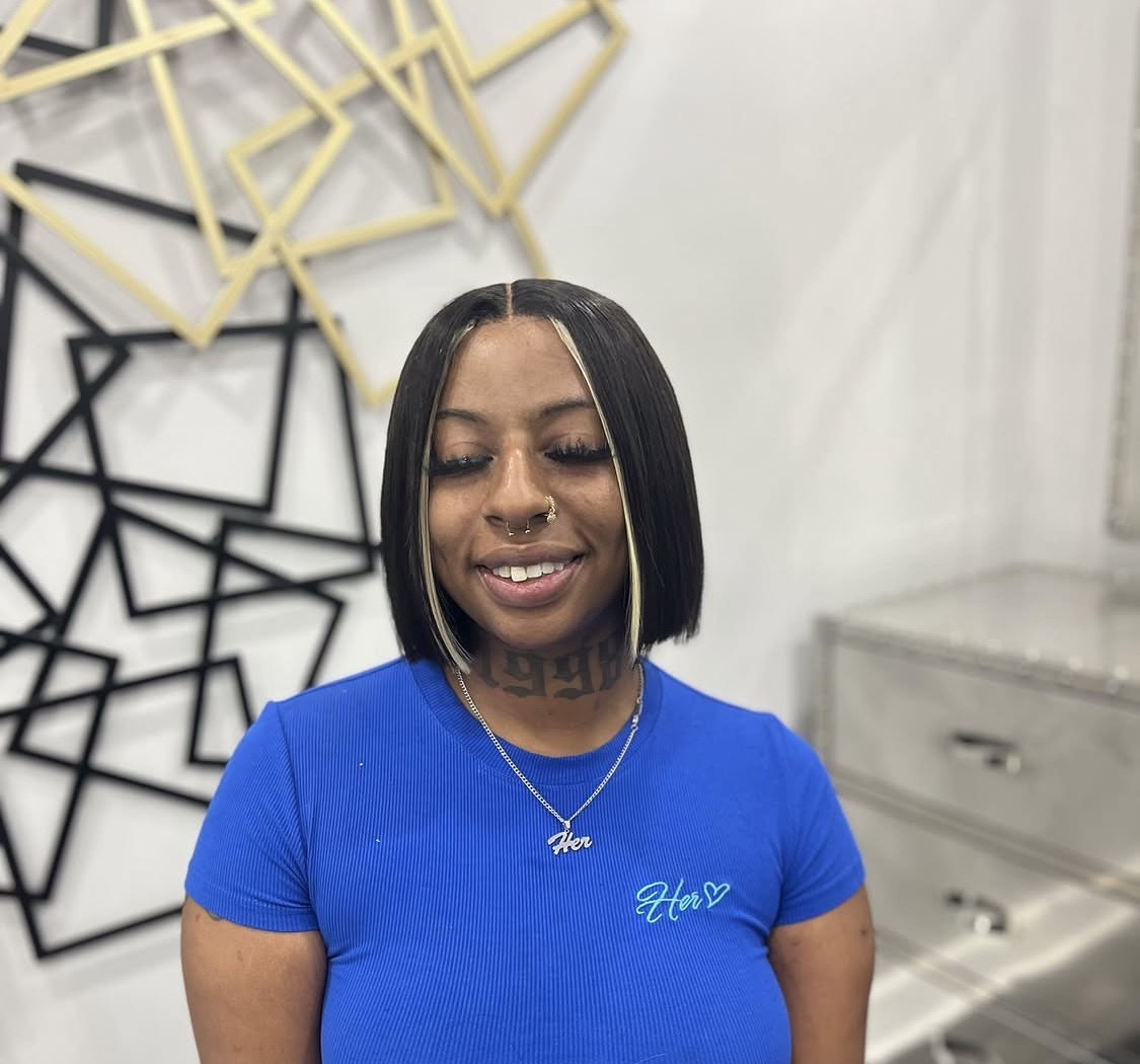 Sleek bob with face-framing blonde accent strands